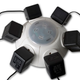 Illustration for article titled Flying Saucer Surge Protector Keeps All Plugs Separate